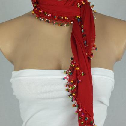 Red scarf with crocheted bead edges..